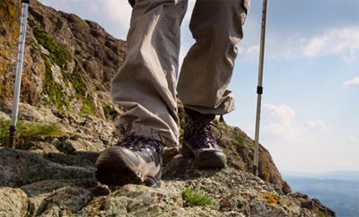 hiking boots with trekking poles