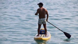 shirtless guy on SUP