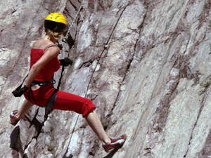 woman rock climbing