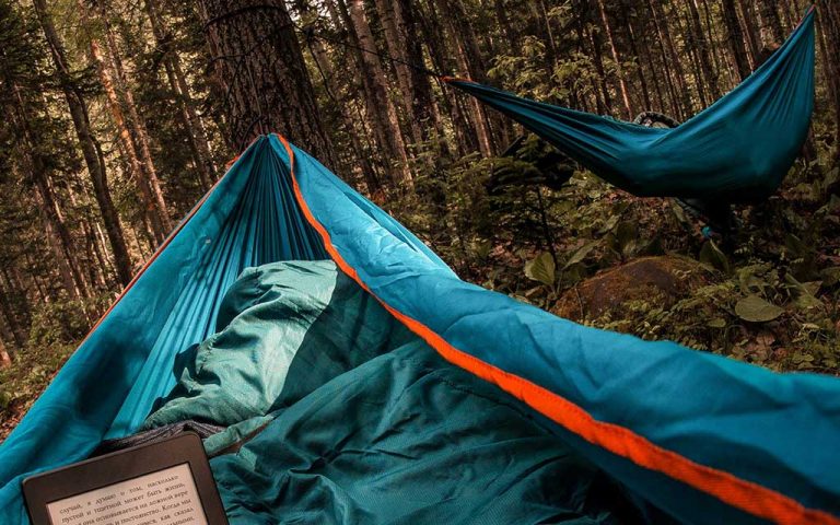 two camping hammocks in the forest