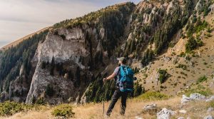 guy hiking with poles