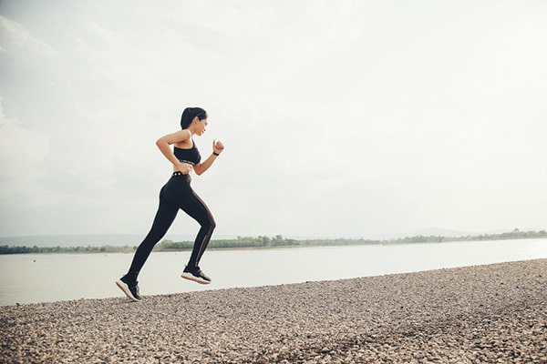 How Running Changes Your Body 2 woman running by water