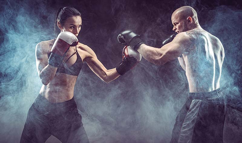 man and woman boxing