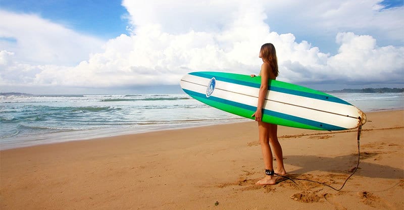 female surfer on beach