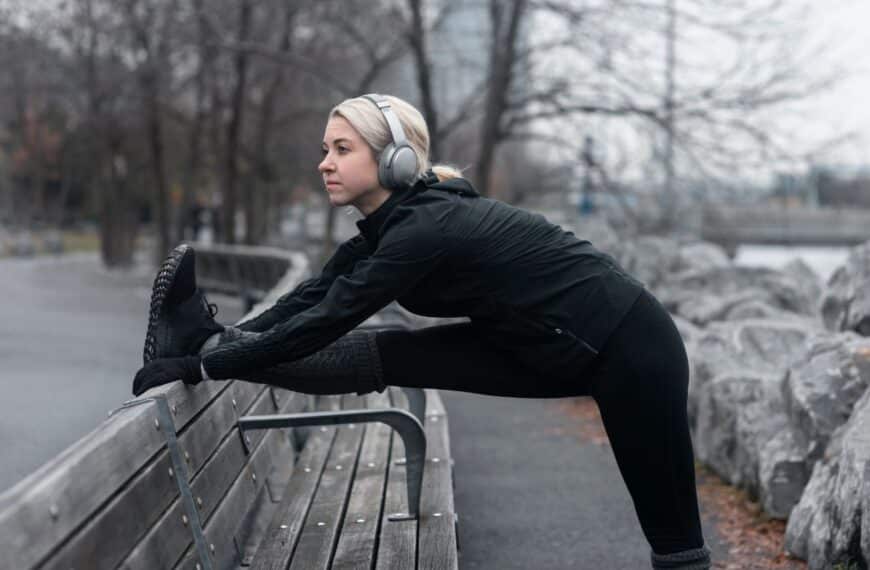 woman stretching outside in winter