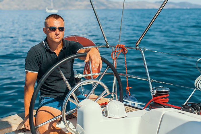 Do You Need A License To Drive A Boat? (Laws For All 50 States) 12 guy driving boat