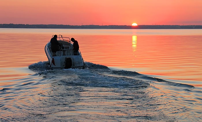 Do You Need A License To Drive A Boat? (Laws For All 50 States) 9 speedboat at sunset