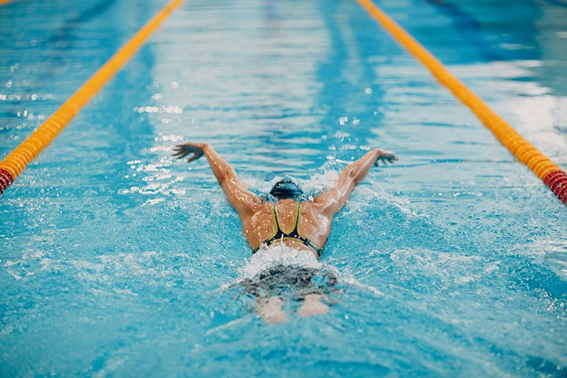Types of Swimming Strokes and Styles 1 woman doing swim strokes
