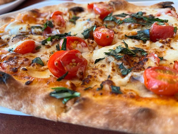 How Much Protein Does Pizza Have? 3 Panera Bread Margherita Flatbread Pizza on plate