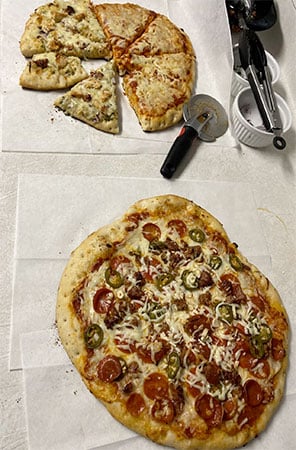 Can You Cut Pizza On A Pizza Stone? 2 cut pizza on counter