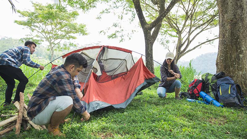friends putting up tent