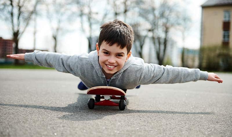 Can You Bring A Skateboard On A Plane? 2 kid making airplane on skateboard