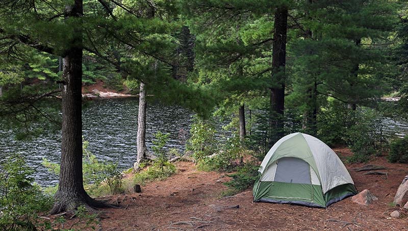 How To Clean A Tent That Smells (Mold, Mildew & Other Odors) 1 tent by river