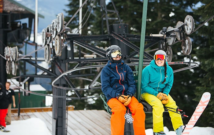 people laughing on chairlift