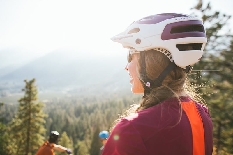 What Is MIPS? Does My Bike Helmet Need It? 1 women wearing mtb helmet
