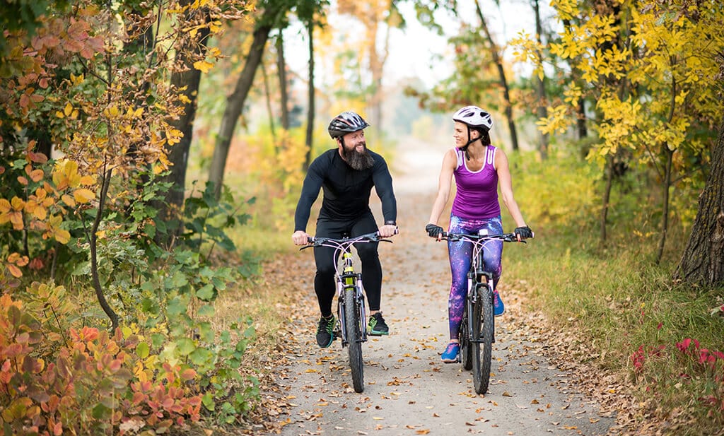 Getting Started With Cycling (Cycling For Beginners) 1 couple cycling on paved trail