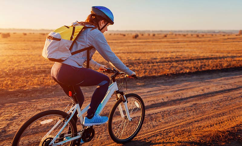 What To Wear Cycling (Beginner's Guide To Cycling Attire) 1 woman on road bike