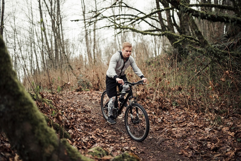 Intro to Mountain Biking for Beginners 5 guy on mountain bike on forest trail