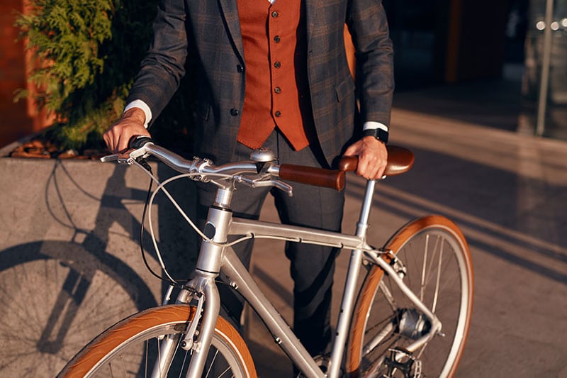 How Far Is Too Far To Bike To Work? 1 man in suit bike commuting